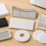 衣類乾燥機の前に複数種類の交換用フィルターを並べたイメージ