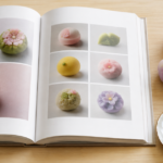 和菓子の写真が載った本と色とりどりの和菓子を並べた様子