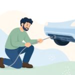カーエアコンのドレンホースを清掃する様子をイメージしたイラスト