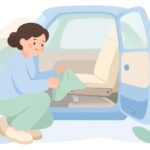 車のシートレールにカバーを付ける様子をイメージしたイラスト