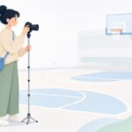 一脚を使って体育館で撮影するカメラマンの様子をイメージしたイラスト