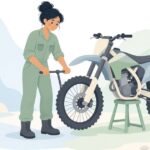 オフロードバイクのアクスルを抜く様子をイメージしたイラスト