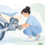 オフロードバイクのリアアクスルブロックを調整する様子をイメージしたイラスト