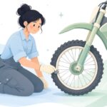 オフロードバイクのリムロック穴にキャップを付ける様子をイメージしたイラスト