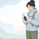 雨の中で無線機に防水カバーを付ける様子をイメージしたイラスト