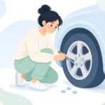 ホイールナットキャップを工具で外す様子をイメージしたイラスト